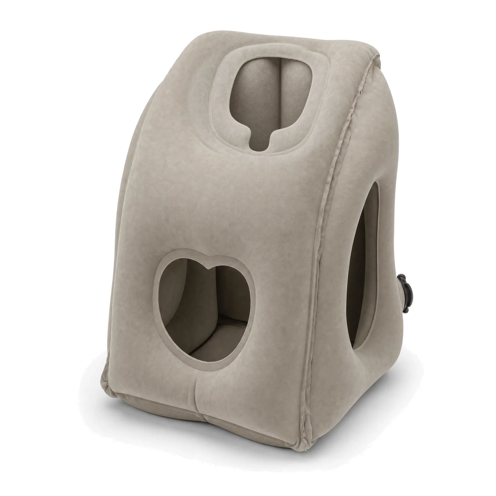 The AeroDoze AD-01 pillow on a white background: a warm greige inflatable pillow with a face cradle in its sloped top, a heart-shaped vent at the front and a large arm opening on the side.